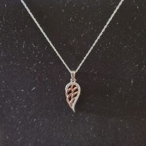 White diamond rose gold angel wing pendant with chain.